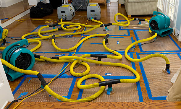 Professional Flood Damage Restoration technician working in Dunlap, OH